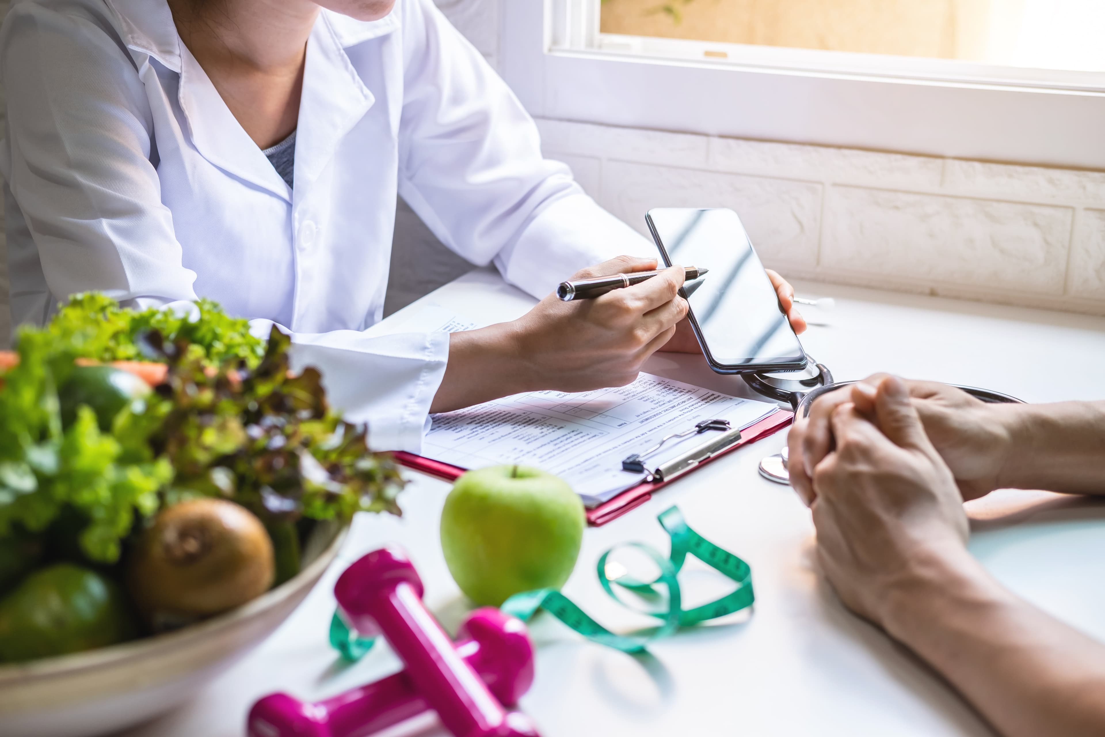 A doctor consulting with a patient about their diet